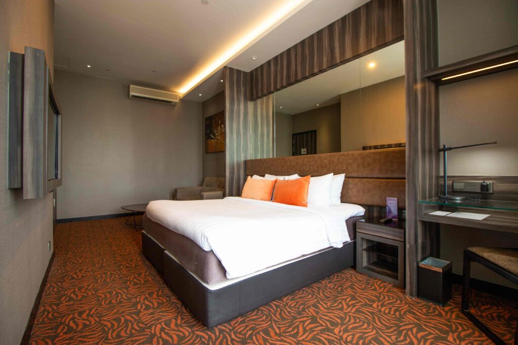 Aqueen Paya Lebar Signature Suite Room bed