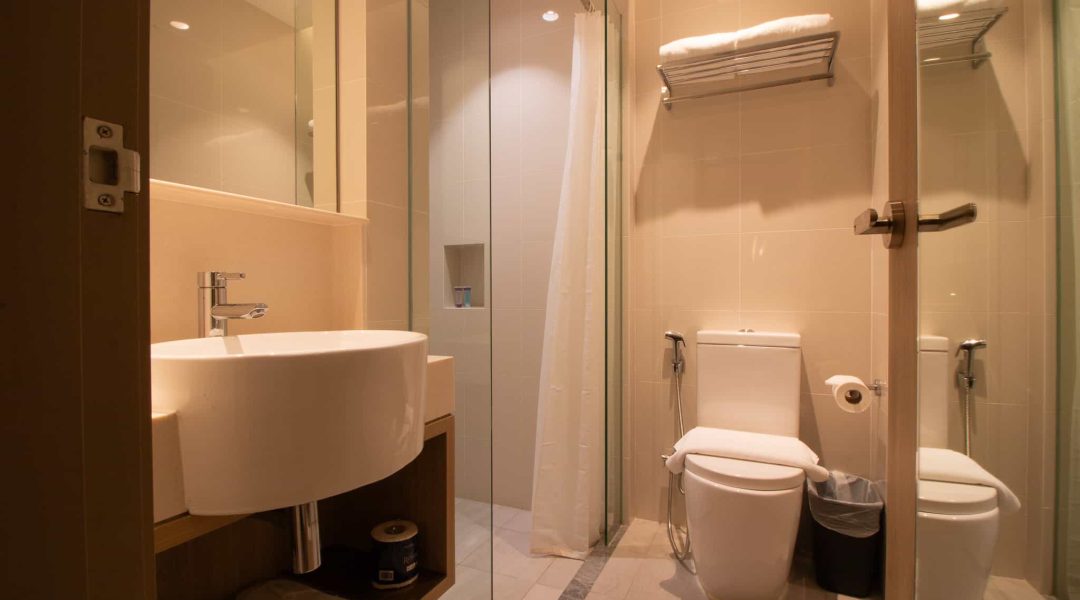 Aqueen Prestige Jalan Besar Deluxe Balcony toilet with sink, toilet bowl and bidet.